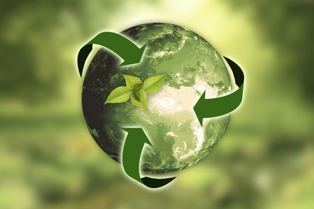 Recycle symbol green around earth